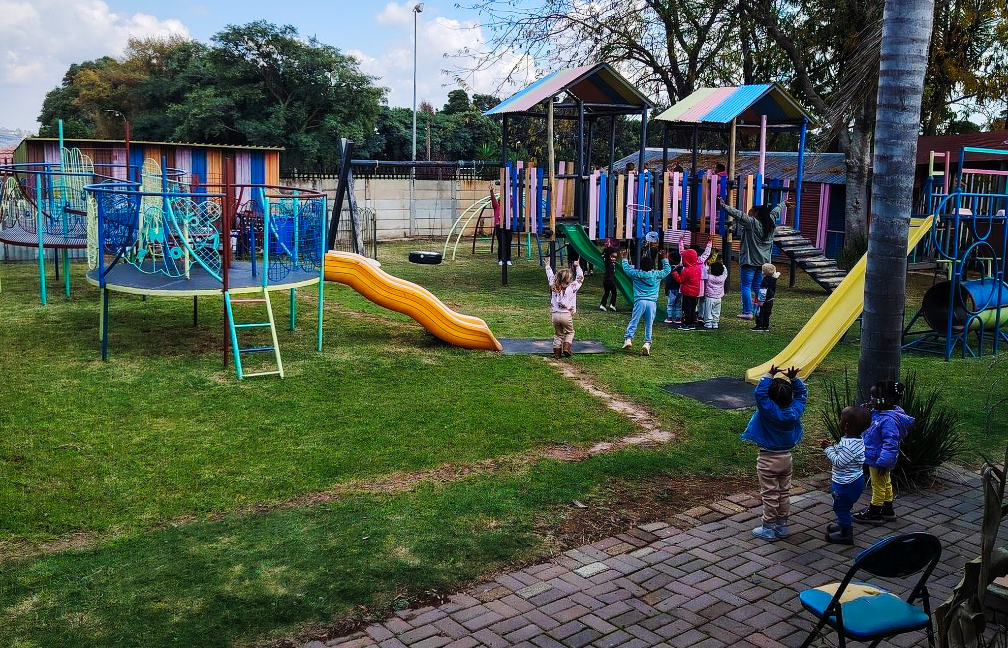 Sunny outdoor playground at Daddy Daycare preschool, Roodepoort